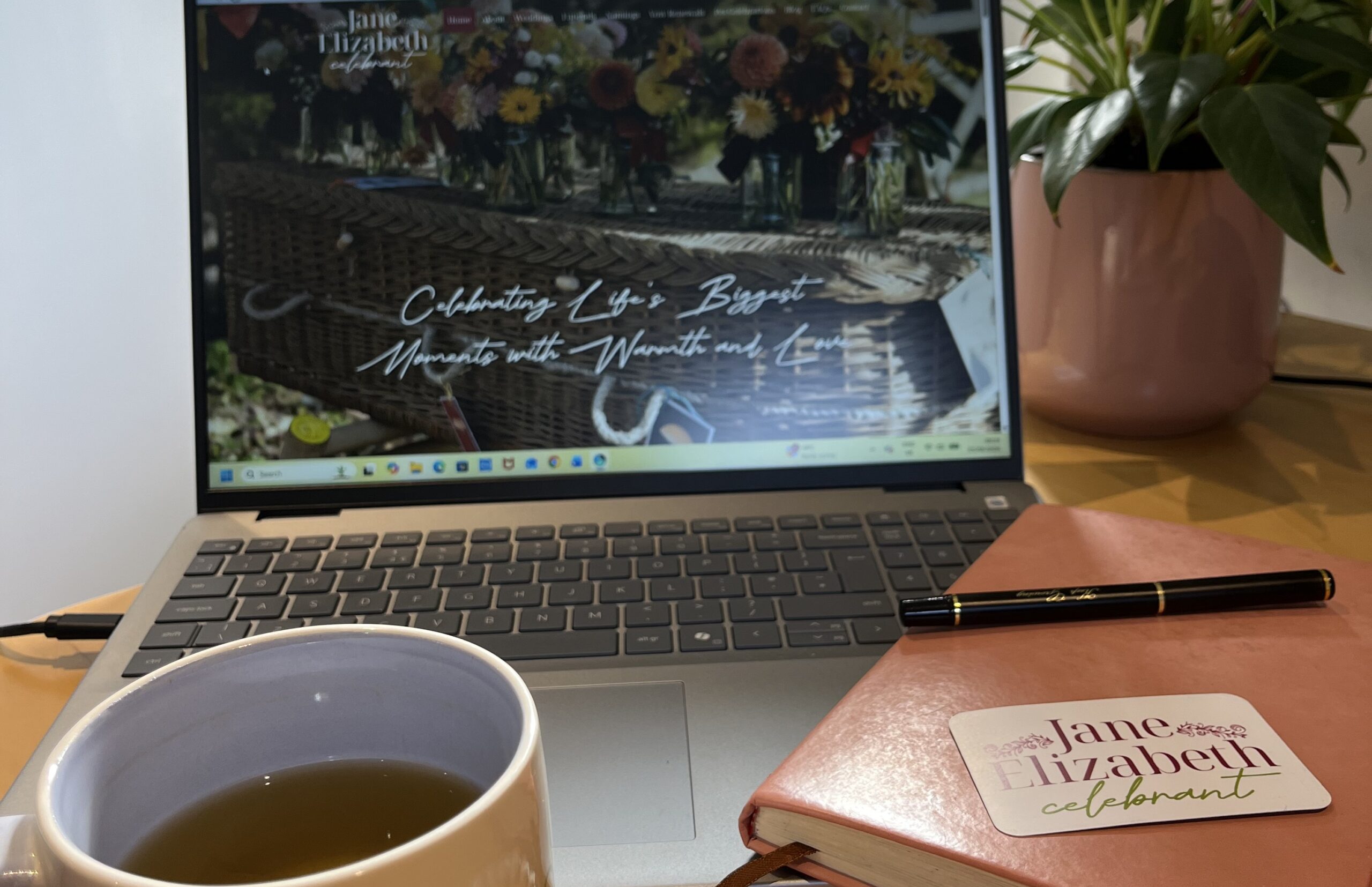 Laptop screen with cup of coffee